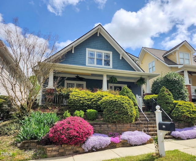 104 Homegate Cir, Apex, NC 27502 - craftsman-style home featuring a ceiling fan, a porch, and stairs