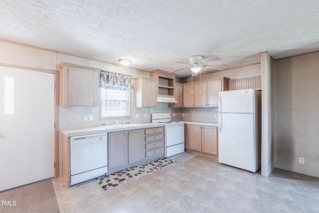 451 Rawls Rd, Aulander, NC 27805 - kitchen with white appliances, under cabinet range hood, light brown cabinetry, light countertops, and a textured ceiling