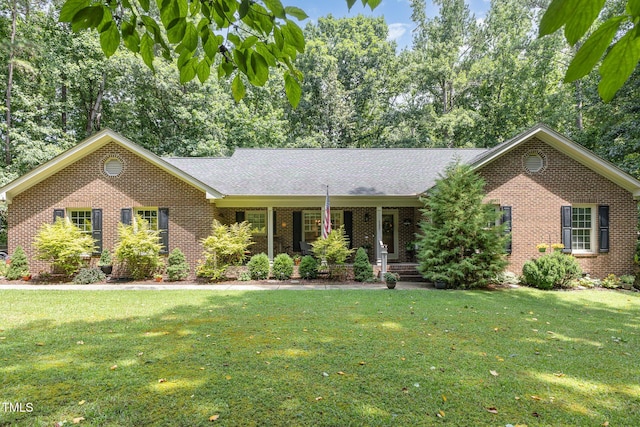 165 Baron Cir, Youngsville, NC 27596 - ranch-style home featuring brick siding, a front yard, and a porch