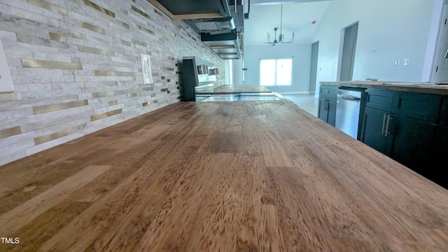 109 N Dunn St, Angier, NC 27501 - unfurnished dining area with wood finished floors and a chandelier