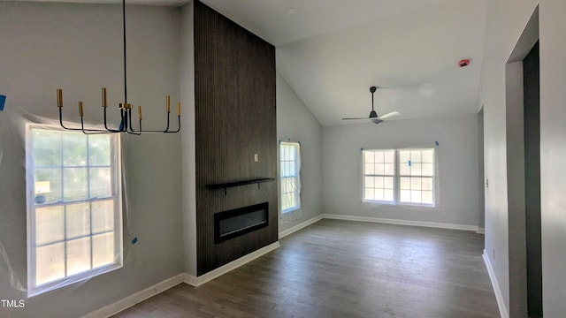 109 N Dunn St, Angier, NC 27501 - unfurnished living room with a large fireplace, wood finished floors, a ceiling fan, high vaulted ceiling, and a chandelier