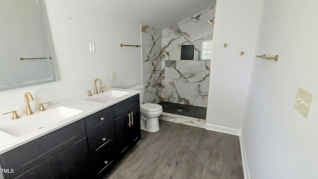 109 N Dunn St, Angier, NC 27501 - bathroom with a marble finish shower, double vanity, and wood finished floors