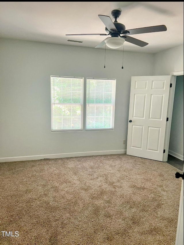 109 N Dunn St, Angier, NC 27501 - unfurnished bedroom featuring carpet and ceiling fan