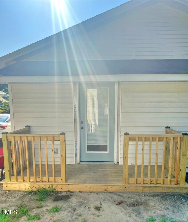 109 N Dunn St, Angier, NC 27501 - property entrance with a wooden deck