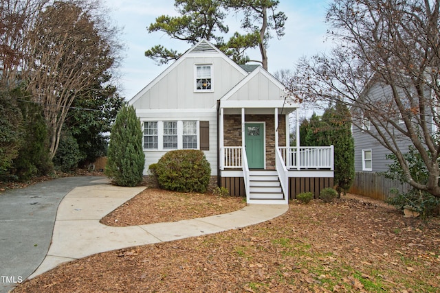 625 New Rd, Raleigh, NC 27608 - view of front of property with board and batten siding and covered porch