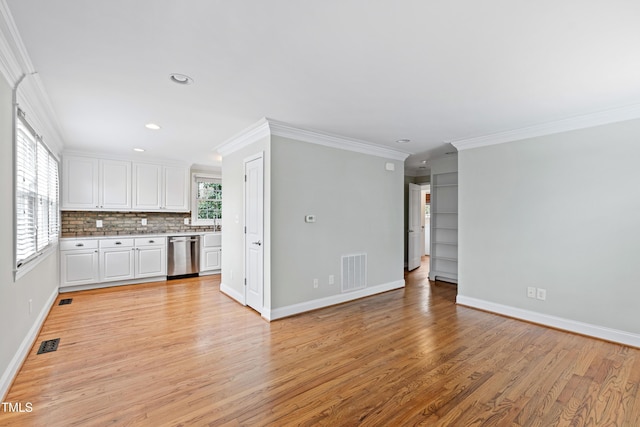 625 New Rd, Raleigh, NC 27608 - kitchen with dishwasher, light countertops, crown molding, white cabinets, and light wood-style flooring