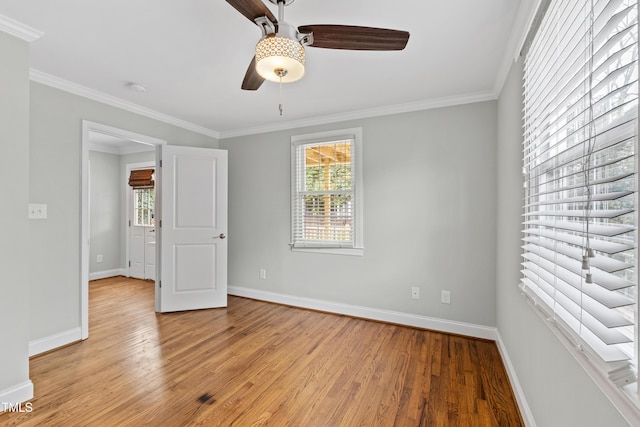 625 New Rd, Raleigh, NC 27608 - unfurnished bedroom featuring light wood-type flooring, ornamental molding, and ceiling fan