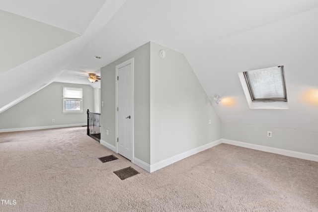 625 New Rd, Raleigh, NC 27608 - additional living space featuring vaulted ceiling, carpet, a skylight, and ceiling fan