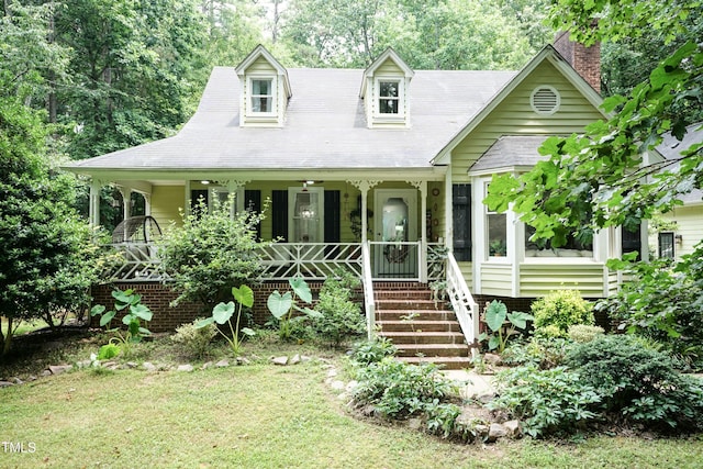 7216 Rabbit Run, Wake Forest, NC 27587 - new england style home with a porch, a chimney, and a front yard