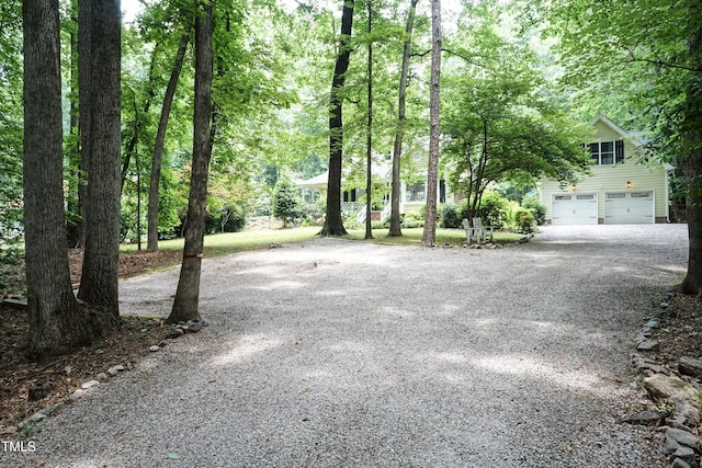 7216 Rabbit Run, Wake Forest, NC 27587 - view of yard with gravel driveway and a garage
