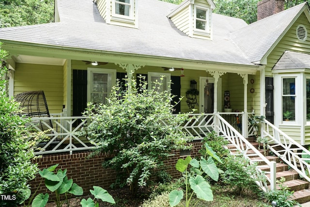 7216 Rabbit Run, Wake Forest, NC 27587 - property entrance with a ceiling fan, covered porch, and a chimney