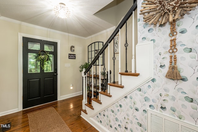 7216 Rabbit Run, Wake Forest, NC 27587 - foyer entrance featuring a chandelier, hardwood / wood-style flooring, stairs, and ornamental molding