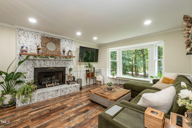 7216 Rabbit Run, Wake Forest, NC 27587 - living room with crown molding, a brick fireplace, wood finished floors, and recessed lighting