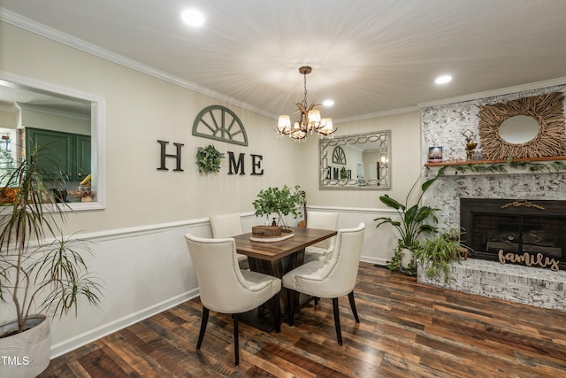7216 Rabbit Run, Wake Forest, NC 27587 - dining room featuring ornamental molding, wood finished floors, a chandelier, recessed lighting, and a brick fireplace