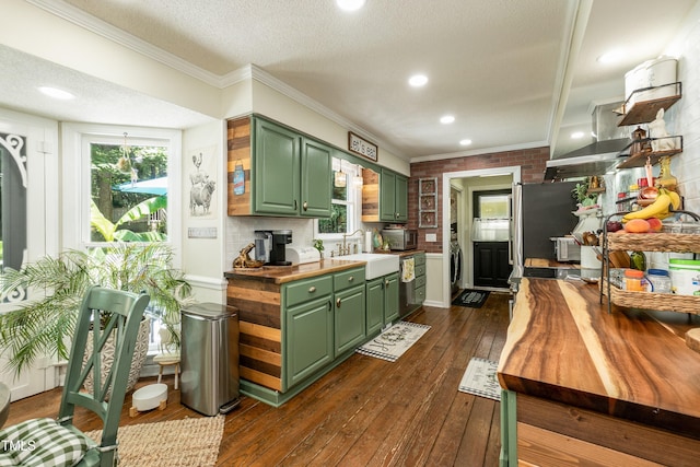 7216 Rabbit Run, Wake Forest, NC 27587 - kitchen with green cabinetry, crown molding, stainless steel microwave, dark wood finished floors, and a textured ceiling