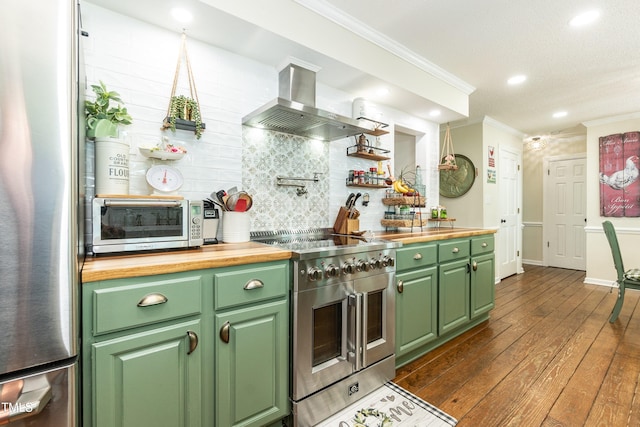 7216 Rabbit Run, Wake Forest, NC 27587 - kitchen featuring appliances with stainless steel finishes, extractor fan, wood counters, green cabinetry, and ornamental molding