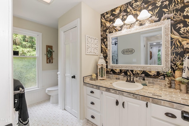 7216 Rabbit Run, Wake Forest, NC 27587 - bathroom with a wainscoted wall, vanity, and tasteful backsplash