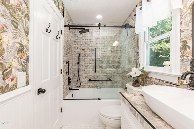 7216 Rabbit Run, Wake Forest, NC 27587 - bathroom with enclosed tub / shower combo, vanity, and a textured ceiling