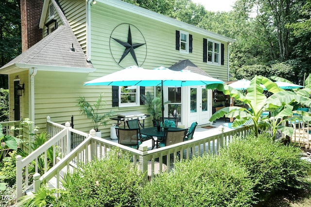 7216 Rabbit Run, Wake Forest, NC 27587 - view of front of home with a chimney, a shingled roof, and a wooden deck