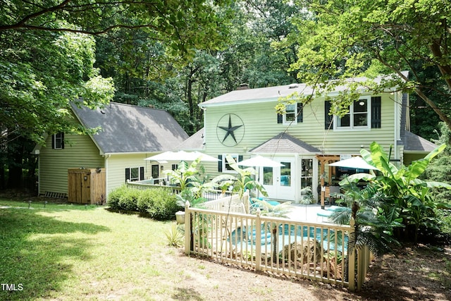 7216 Rabbit Run, Wake Forest, NC 27587 - rear view of house featuring an outdoor pool, a chimney, a shingled roof, a patio, and view of scattered trees