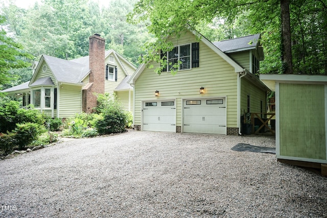 7216 Rabbit Run, Wake Forest, NC 27587 - view of front of home with gravel driveway and a garage