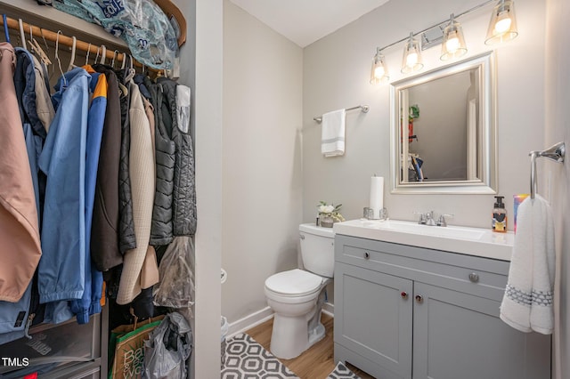 3622 Colchester St Unit 17, Durham, NC 27707 - bathroom featuring wood finished floors, vanity, and a walk in closet