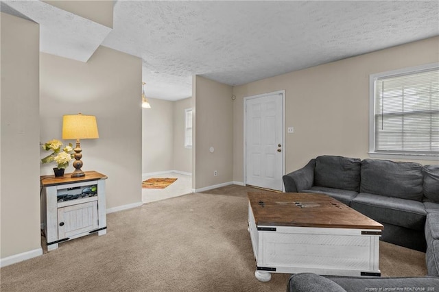 3649 Marcliff Rd, Hope Mills, NC 28348 - carpeted living area featuring baseboards and a textured ceiling