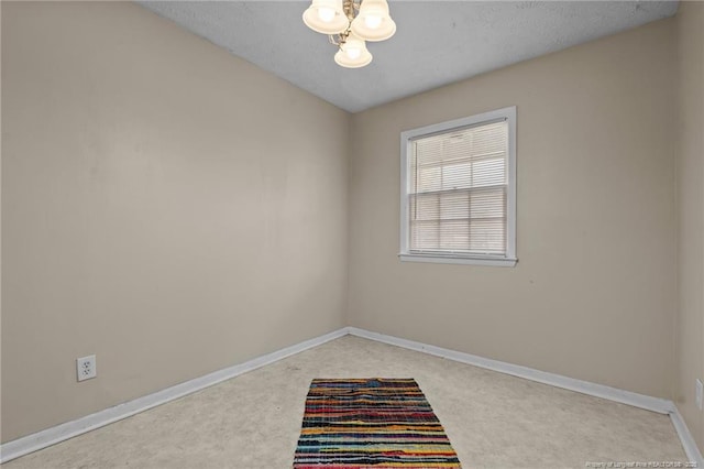 3649 Marcliff Rd, Hope Mills, NC 28348 - spare room featuring light carpet and a textured ceiling