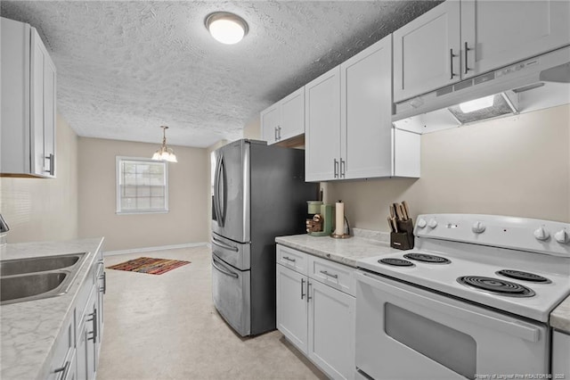 3649 Marcliff Rd, Hope Mills, NC 28348 - kitchen featuring electric range, under cabinet range hood, freestanding refrigerator, white cabinets, and light countertops