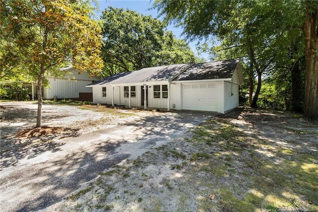 1809 Wendover Dr, Fayetteville, NC 28304 - view of front facade featuring a garage and asphalt driveway