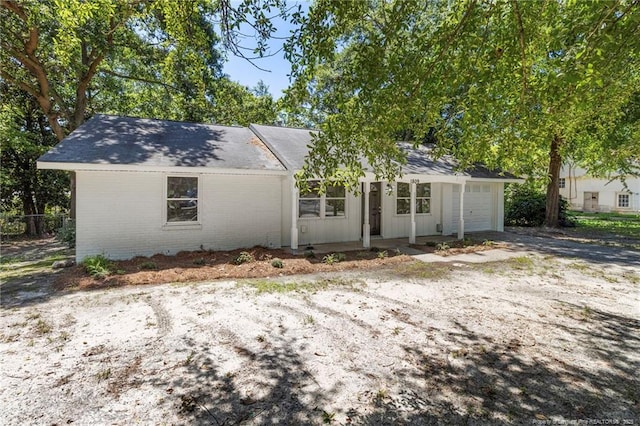 1809 Wendover Dr, Fayetteville, NC 28304 - view of front facade with an attached garage and brick siding