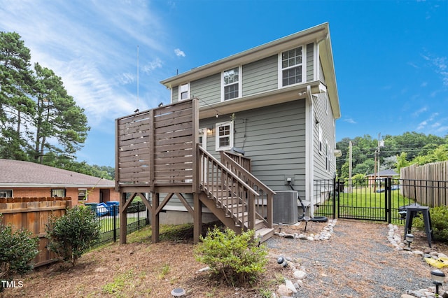 1819 Nixon St, Durham, NC 27707 - rear view of house with a fenced backyard, stairway, a deck, and a gate