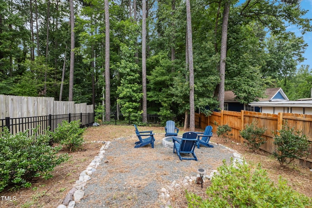 1819 Nixon St, Durham, NC 27707 - fenced backyard with a fire pit