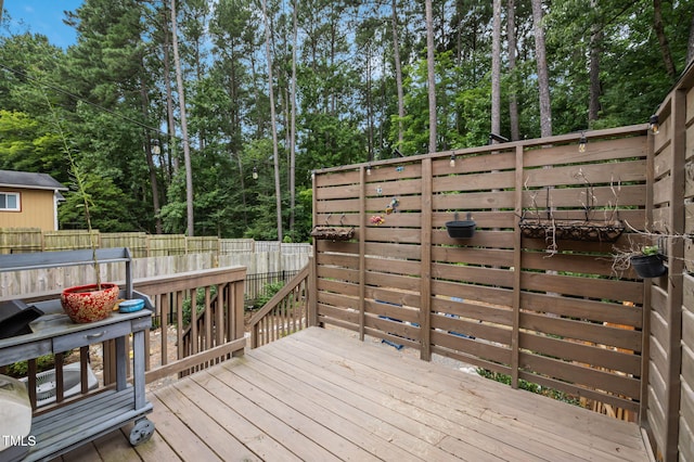 1819 Nixon St, Durham, NC 27707 - deck featuring view of scattered trees and a fenced backyard