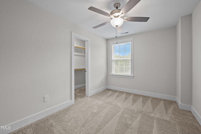 1819 Nixon St, Durham, NC 27707 - unfurnished bedroom with carpet floors, a spacious closet, and ceiling fan