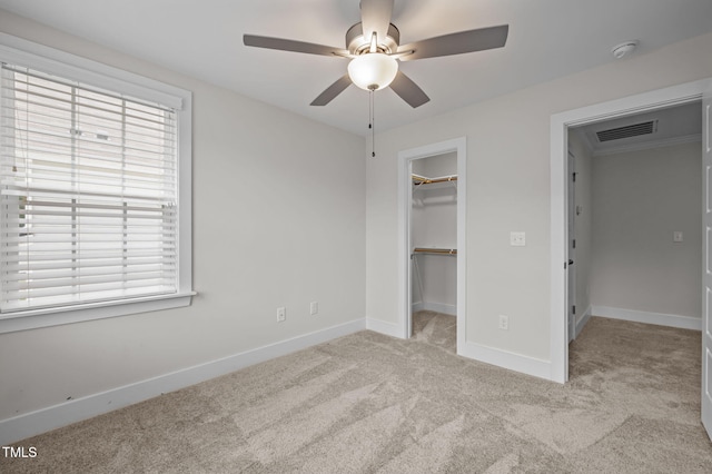 1819 Nixon St, Durham, NC 27707 - unfurnished bedroom with carpet floors, a spacious closet, and a ceiling fan