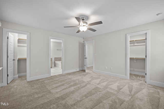 1819 Nixon St, Durham, NC 27707 - unfurnished bedroom featuring a walk in closet, connected bathroom, carpet floors, and a ceiling fan
