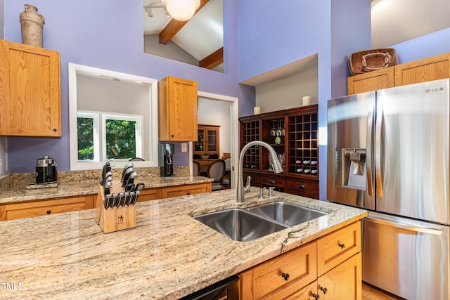 28 Benchmark, Pittsboro, NC 27312 - kitchen with stainless steel fridge with ice dispenser, beamed ceiling, light stone countertops, and high vaulted ceiling