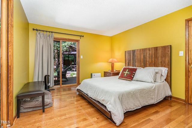28 Benchmark, Pittsboro, NC 27312 - bedroom with access to exterior and light wood finished floors