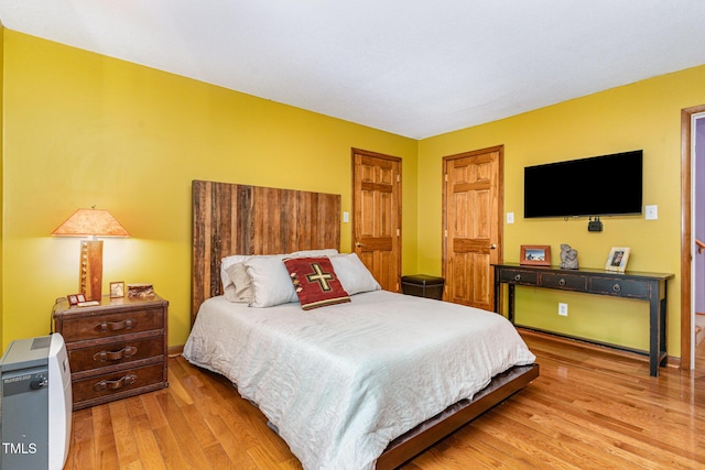 28 Benchmark, Pittsboro, NC 27312 - bedroom featuring light wood-style flooring and baseboards