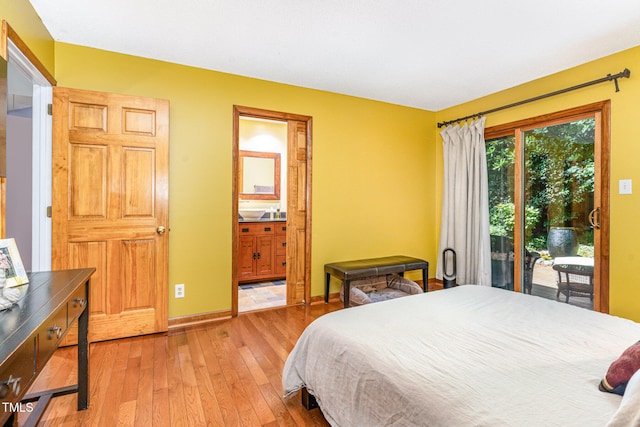 28 Benchmark, Pittsboro, NC 27312 - bedroom with access to exterior, light wood-style floors, and ensuite bath