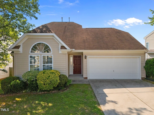 1308 Snyder St, Durham, NC 27713 - view of front of property with driveway, an attached garage, roof with shingles, and a front lawn