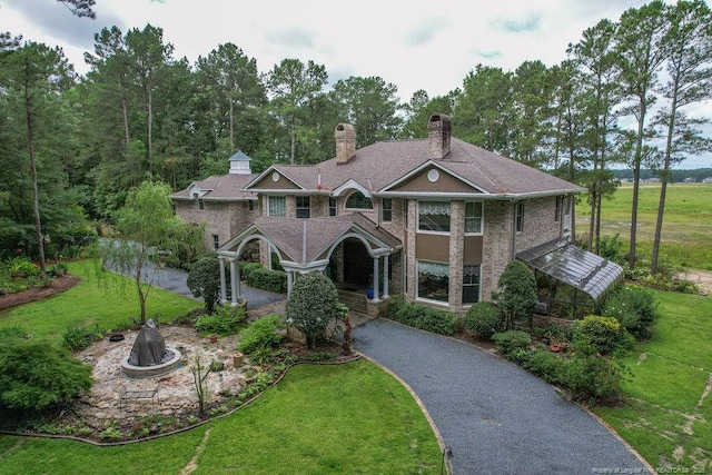 1064 Tresses Ct, Vass, NC 28394 - view of front of property with a front lawn, a chimney, and asphalt driveway