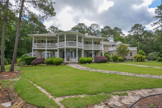 1064 Tresses Ct, Vass, NC 28394 - view of front of house featuring a balcony, a front yard, and a porch