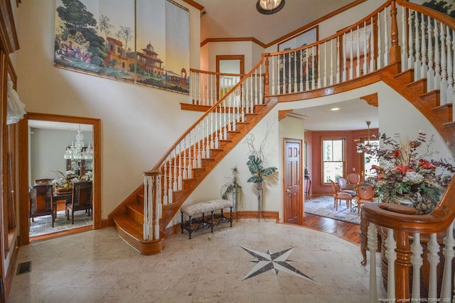 1064 Tresses Ct, Vass, NC 28394 - entryway with stairway, a towering ceiling, a chandelier, and crown molding