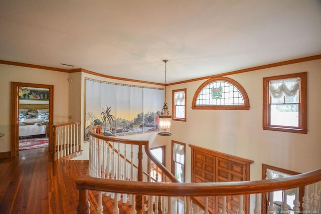 1064 Tresses Ct, Vass, NC 28394 - hallway featuring an upstairs landing, hardwood / wood-style floors, ornamental molding, and a chandelier