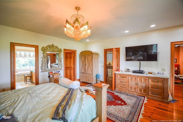 1064 Tresses Ct, Vass, NC 28394 - bedroom with wood finished floors, a chandelier, and recessed lighting
