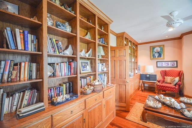1064 Tresses Ct, Vass, NC 28394 - living area with light wood-type flooring, a ceiling fan, and crown molding