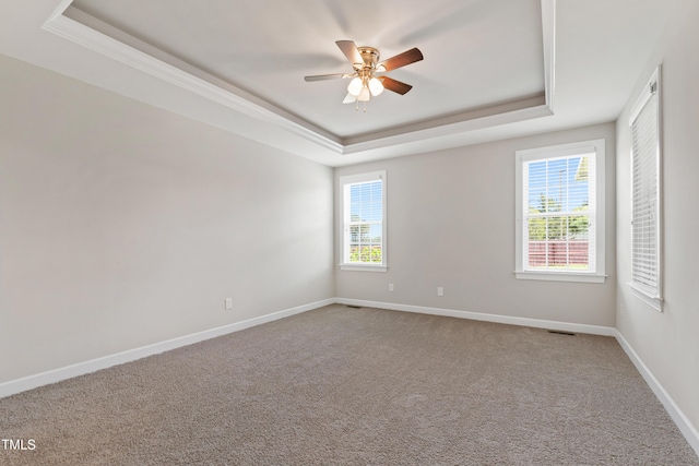 24 Windchime Ct, Clayton, NC 27527 - spare room with a tray ceiling, ceiling fan, carpet flooring, and crown molding