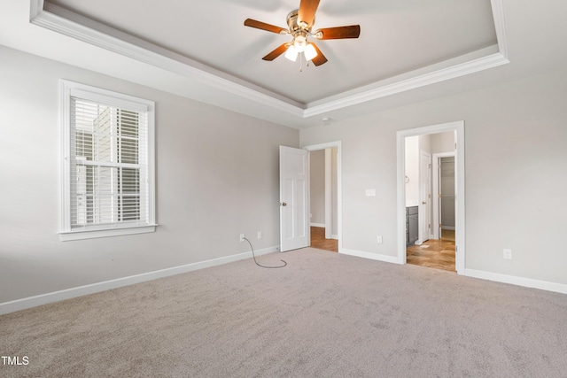 24 Windchime Ct, Clayton, NC 27527 - unfurnished bedroom with a raised ceiling, crown molding, and carpet